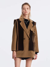 a woman in coat with shawl